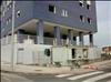 cierre edificio ladrillo y caseta